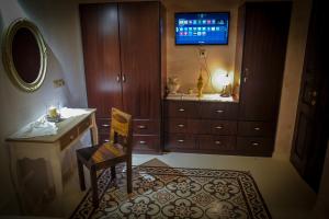 A television and/or entertainment centre at Villa Amalia