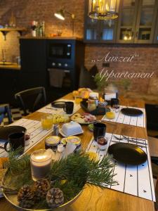 a wooden table with food on top of it at Auszeit-Appartement Wernigerode in Wernigerode