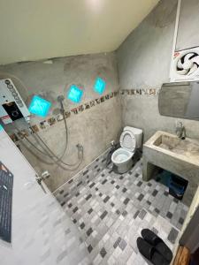 a bathroom with a shower and a toilet and a sink at Star View Garden in Sai Yok