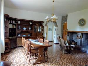 a dining room with a table and chairs at Casale La Pineta in Mombaroccio