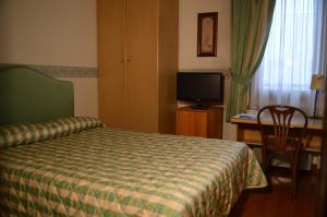 Postel nebo postele na pokoji v ubytování Hotel Sagittario