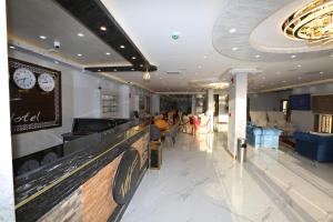 a bowling alley in a mall with people sitting at Venus Hotel in Wadi Musa