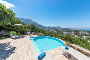 a swimming pool in a villa with a view at Villa dei Lecci - 7 Luxury villas with private pool or jacuzzi in Ischia