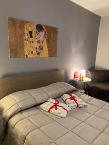 a bedroom with a bed with red bows on it at Casa Vacanze Le Ginestre in Caltanissetta