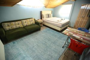 Postel nebo postele na pokoji v ubytování Bella Suit Apart Hotel