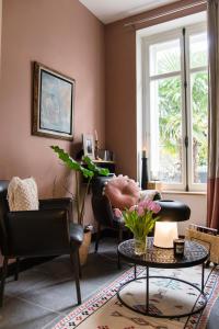 Ein Sitzbereich in der Unterkunft Villa Louisa