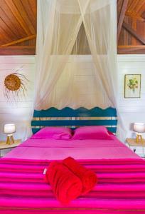 Posteľ alebo postele v izbe v ubytovaní Piton Bungalows Ecolodges