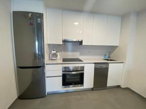A kitchen or kitchenette at New and cosy apartment - 4 min walk from the beach - La Tejita - El Medano