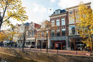 a group of buildings on a street next to a river at BB88 in Leeuwarden