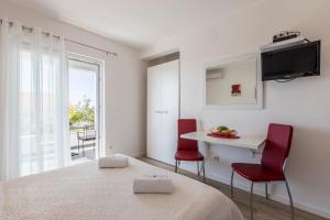 Posteľ alebo postele v izbe v ubytovaní Hvar De Luxe Apartments