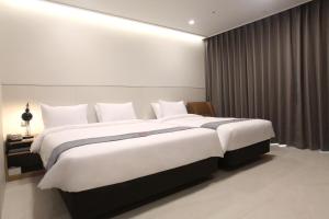 Postelja oz. postelje v sobi nastanitve Hotel Skypark DaejeonⅠ
