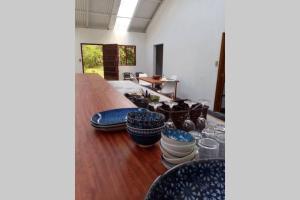 a room with a table and some chairs and a table at Casa Bolita in Dos Brazos