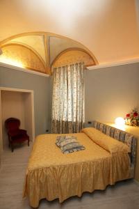 Tempat tidur dalam kamar di Mondovì Ridente