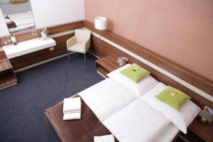 Ένα ή περισσότερα κρεβάτια σε δωμάτιο στο Primus Hotel & Apartments