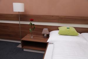 Posteľ alebo postele v izbe v ubytovaní Primus Hotel & Apartments
