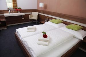 Tempat tidur dalam kamar di Primus Hotel & Apartments