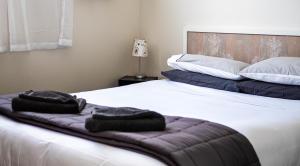 Posteľ alebo postele v izbe v ubytovaní Clyde Central