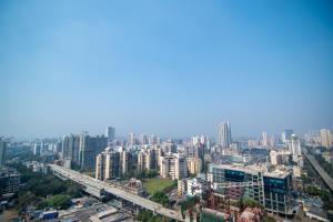 an aerial view of a city with tall buildings at OSI Apartments Jogeshwari West in Mumbai