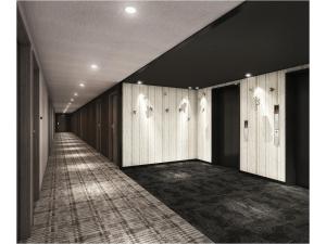 a hallway with wood paneled walls and a carpet at Smile Hotel Okayama in Okayama