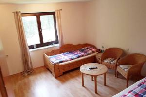 Ein Bett oder Betten in einem Zimmer der Unterkunft Urlaub zwischen den Meeren auf Hof Jørlon