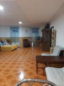 a large living room with a wooden floor and furniture at Семейный отдых у моря в Черноморке in Odesa