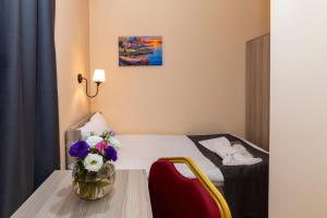 Ένα ή περισσότερα κρεβάτια σε δωμάτιο στο Golden Flower Hotel