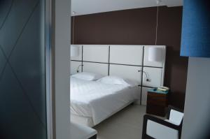 Postel nebo postele na pokoji v ubytování Hotel Sagittario