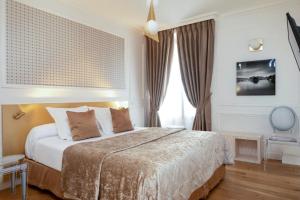 Cama ou camas em um quarto em Hôtel du Levant
