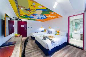 Ένα ή περισσότερα κρεβάτια σε δωμάτιο στο Norway Forest Travel hotel 1 Taichung