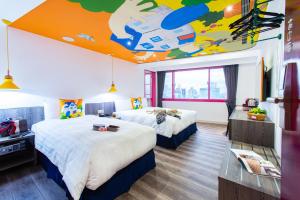 Ένα ή περισσότερα κρεβάτια σε δωμάτιο στο Norway Forest Travel hotel 1 Taichung