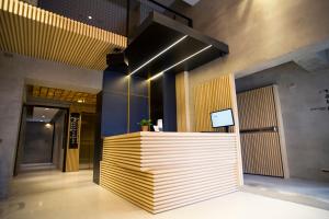 a lobby with a reception desk in a building at FFF Hotel in Hengchun