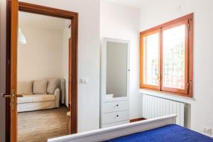 A bed or beds in a room at Mondello Sabrina Apartments