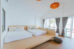 Voodi või voodid majutusasutuse Vimarn Samed Resort toas