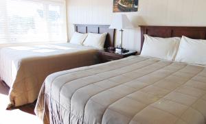Postel nebo postele na pokoji v ubytování Copley LaReine Motel