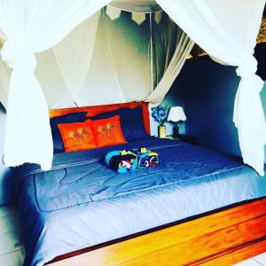 Postel nebo postele na pokoji v ubytování Bukit Catu Bungalows