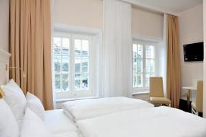 Postel nebo postele na pokoji v ubytování Hotel Fürst Bismarck