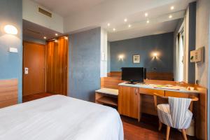 Postel nebo postele na pokoji v ubytování SenB Hotel