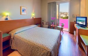 Postel nebo postele na pokoji v ubytování SenB Hotel