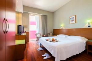 Postel nebo postele na pokoji v ubytování SenB Hotel