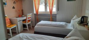 Postel nebo postele na pokoji v ubytování Hotel Sonnenhof