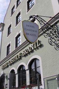 a sign on the side of a building at Hotel Brantl in Roding