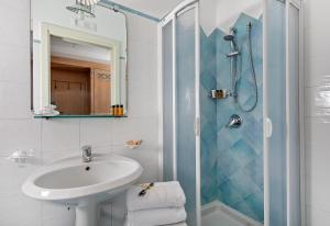 a bathroom with a sink and a shower at Hotel Al Mulino in Anacapri