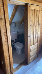 a bathroom with a toilet and a sink at Etno selo Sljeme in Žabljak