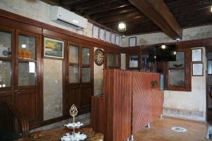 a room with wooden walls and a clock on the wall at Beliz Hanım Konakları in Gaziantep