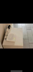 a white table with a book on top of it at Terrazza mare home in Rodi Garganico +40 photos