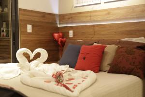 Llit o llits en una habitació de Nakamiti Singular Apart Arujá SP