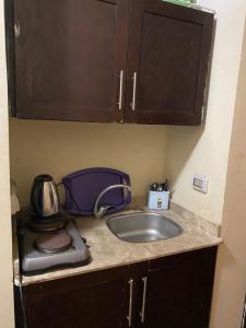 a kitchen counter with a sink and a toaster at Sea View Chalet with Garden at Porto South Beach - Families Only in Ain Sokhna