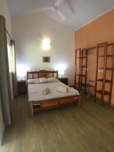 a bedroom with a bed with two towels on it at Magic Mountain Lodge in Las Lajas +28 photos