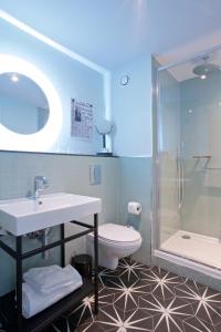 a bathroom with a sink and a toilet and a shower at Telegraph Hotel - Coventry in Coventry