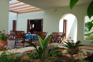 a patio with chairs and a table in a house at Vilana Studios in Kálamos Kythira